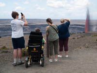 Group of visitors viewing the eruption from the crater