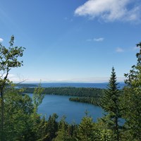The forested islands of Isle Royale National Park surrounded by Lake Superior. 