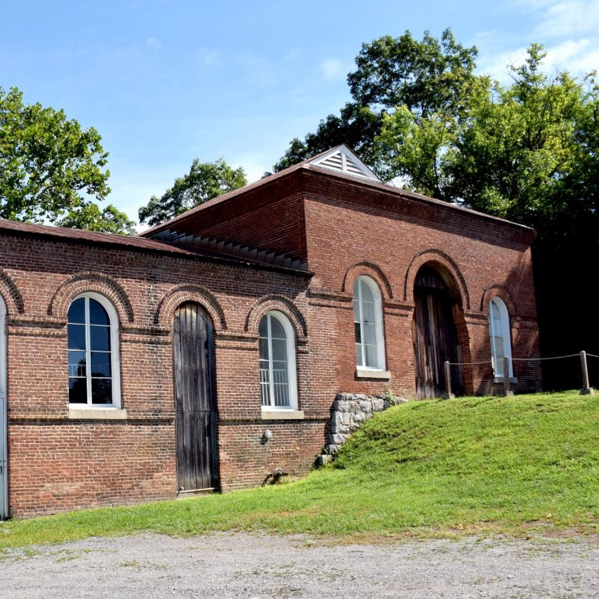 Image of large brick trolley barn viewed from the front 