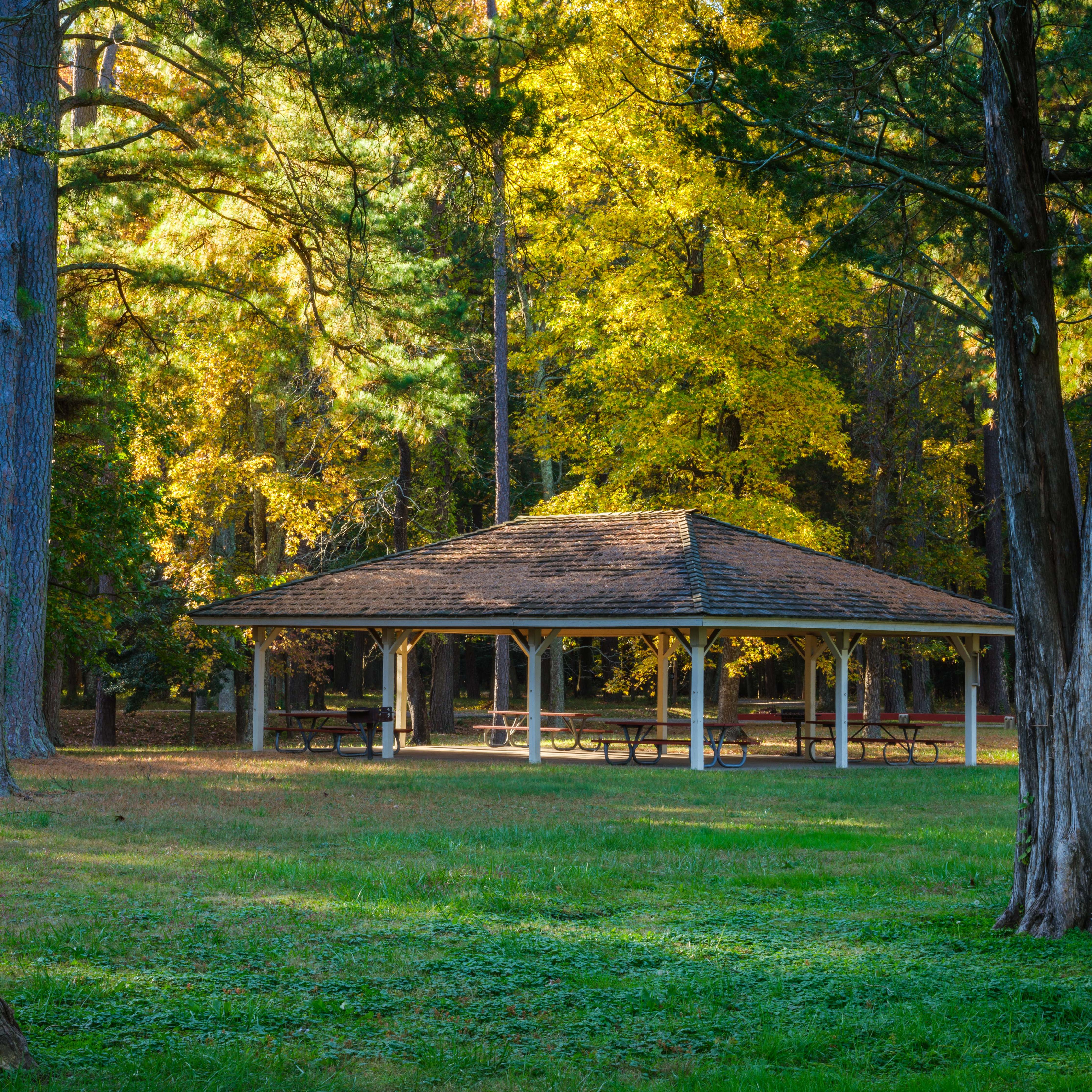 an overhang with picnic tables underneath.