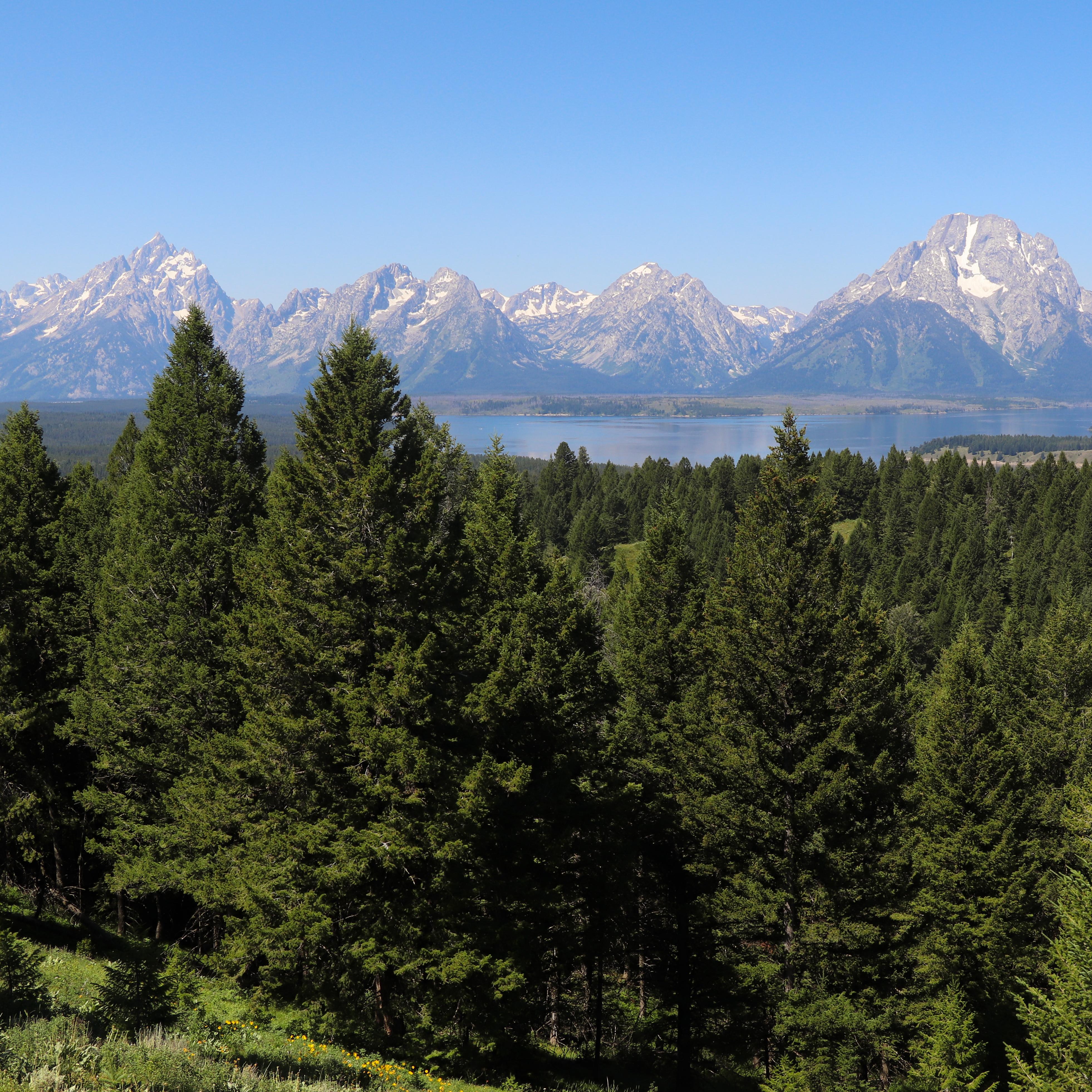 A mountain range and a lake as viewed from a high vantage point.