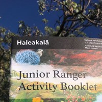 A colorful cover shows native plants and animals and says