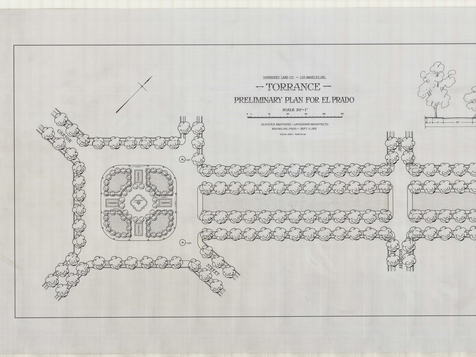 Two tree lined roads lead to square with fountain in middle with trees around it