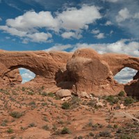 two massive stone arches connected in the middle