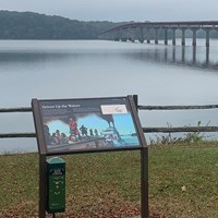 Informative panel explaining Trail of Tears in foreground. Tennessee River flows in distance