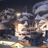 Photo of exhibits inside the Lincoln Borglum Visitor Center showing tools and photos.