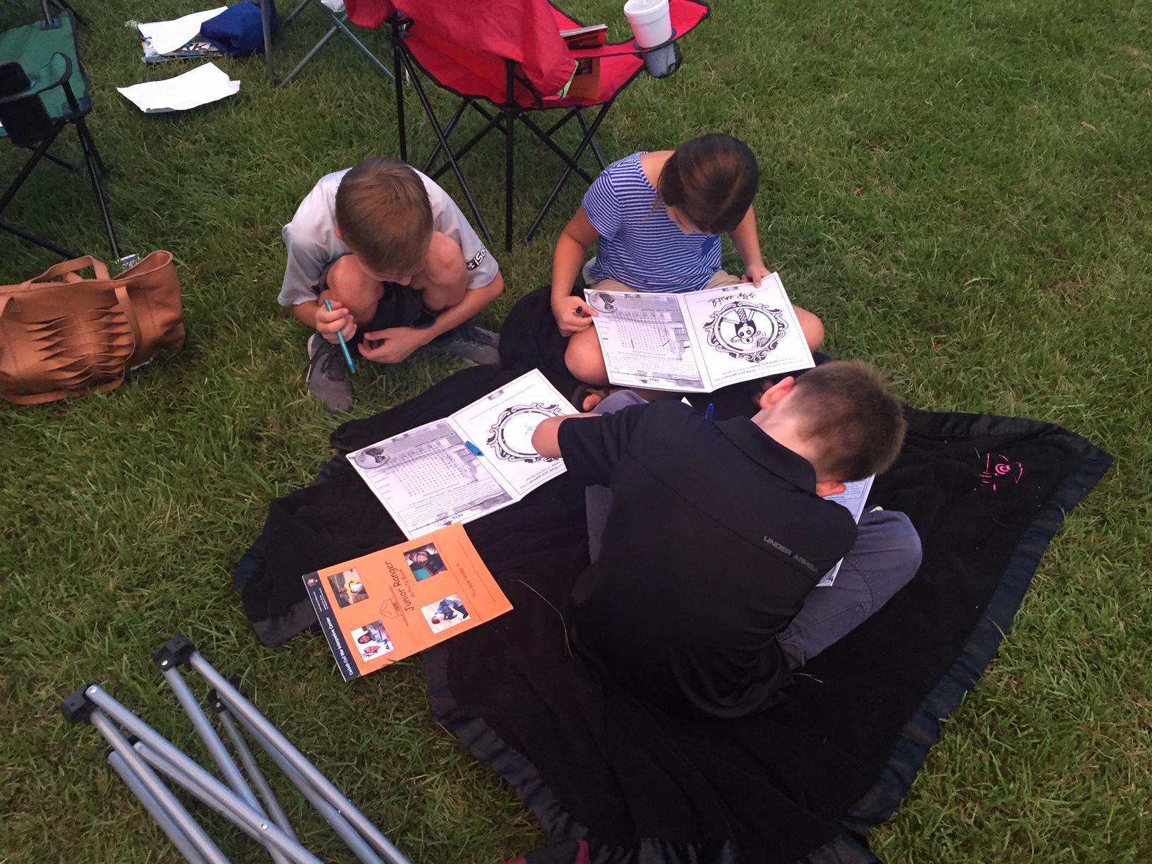 Kids completing Jr. Ranger books.