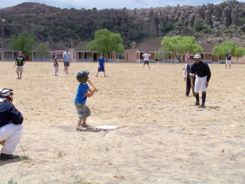 A group of people playing baseball.