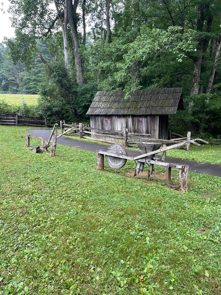 Farm implements sitting on the Mabry Mill grounds.