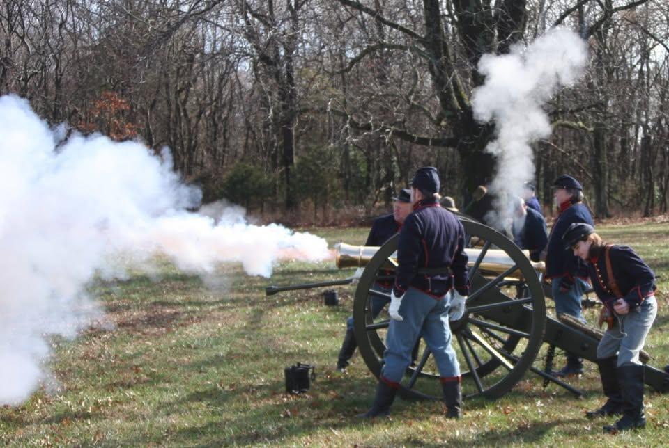 A six pound cannon being fired by union soldiers during a living history demonstration.