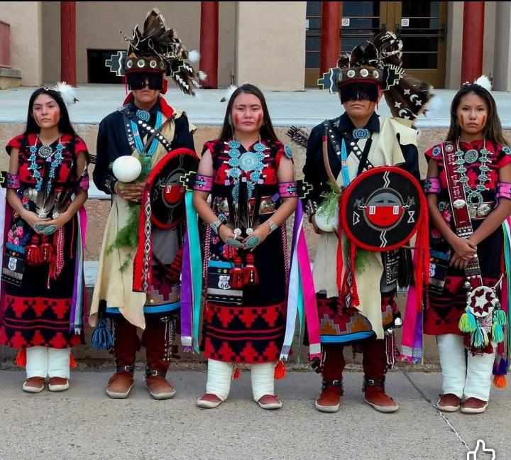 A group of Native American individuals in regalia
