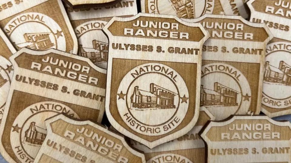 picture of collage of wooden Junior Ranger badges