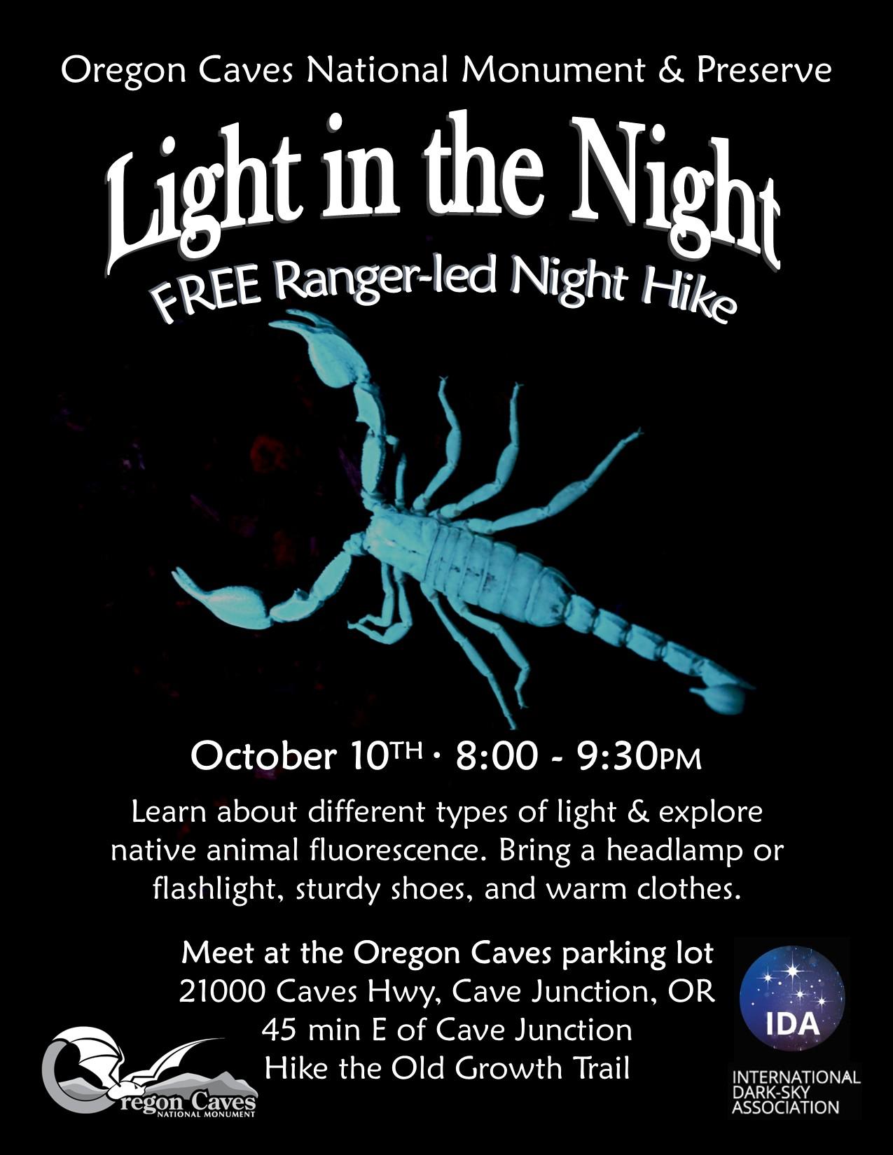 A fluorescent blue scorpion appears on a black background surrounded by white text
