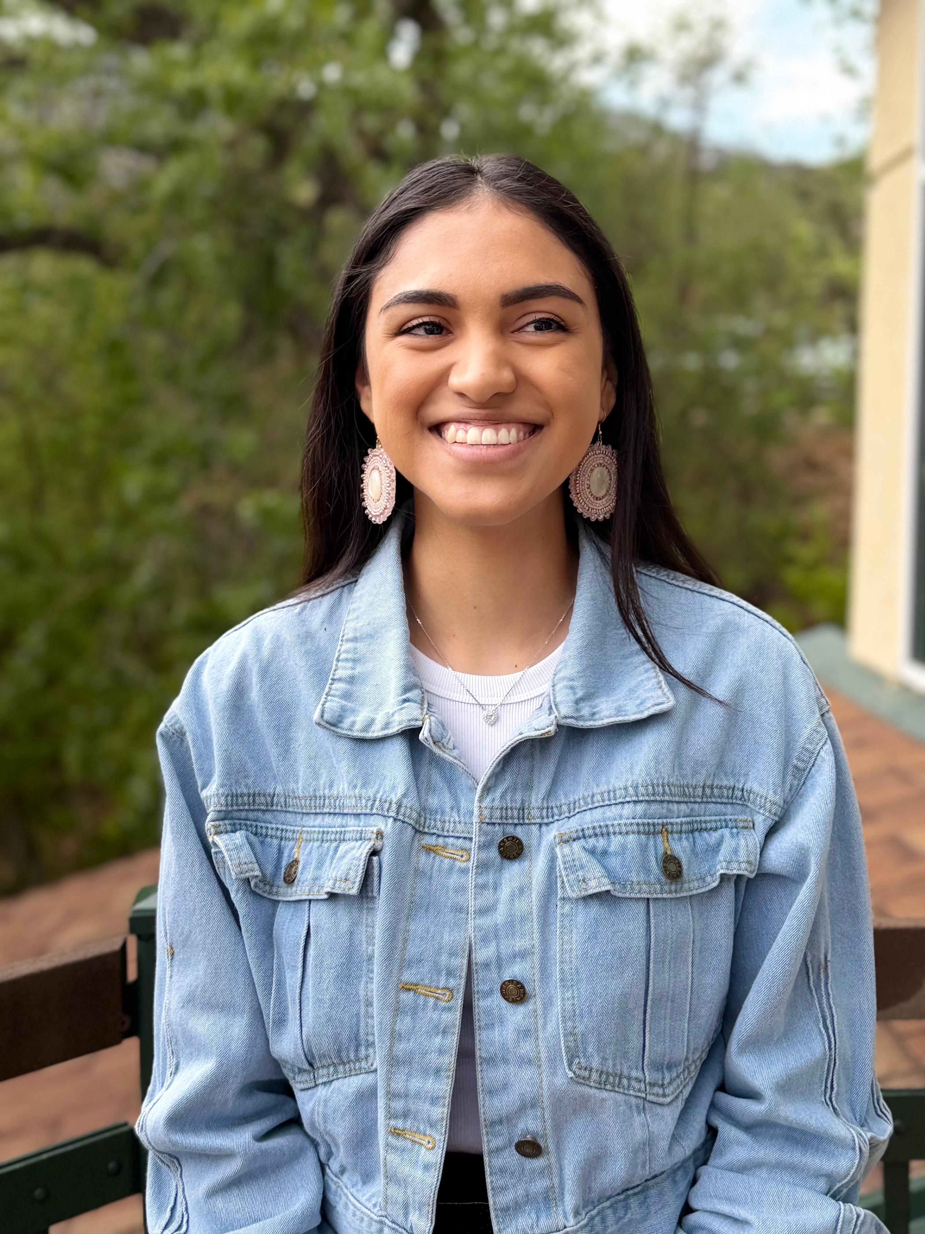 Headshot photo of Journey Nii&rsquo;eihii Hisei LeBeau, standing outside with trees in the background