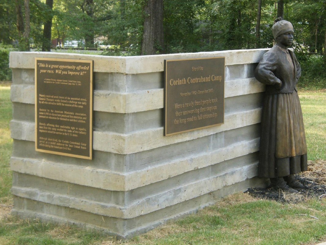 bronze statue of a woman greets visitors to the Corinth Contraband Camp