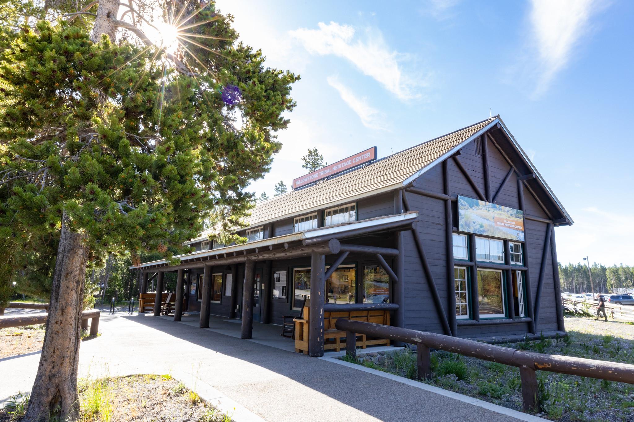 A large brown, wooden building with the sign: Yellowstone Tribal Heritage Center
