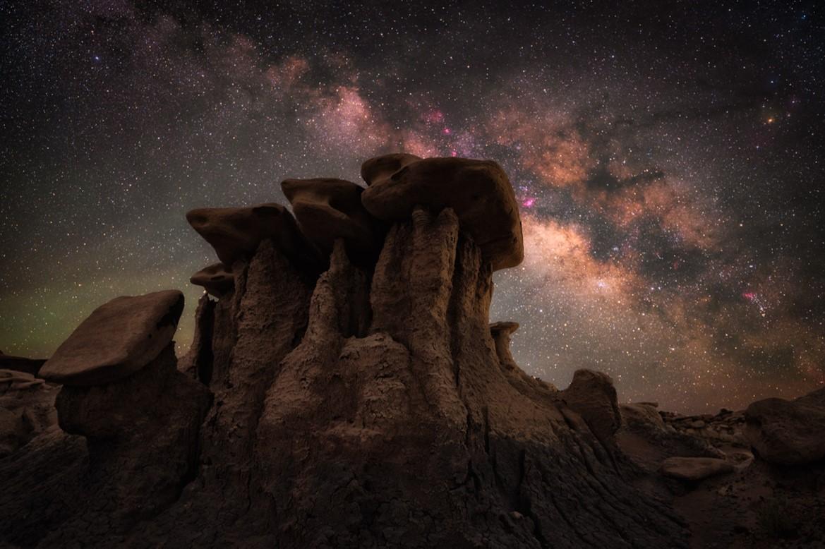 The Milky Way glimmers above a whimsical rock formation.