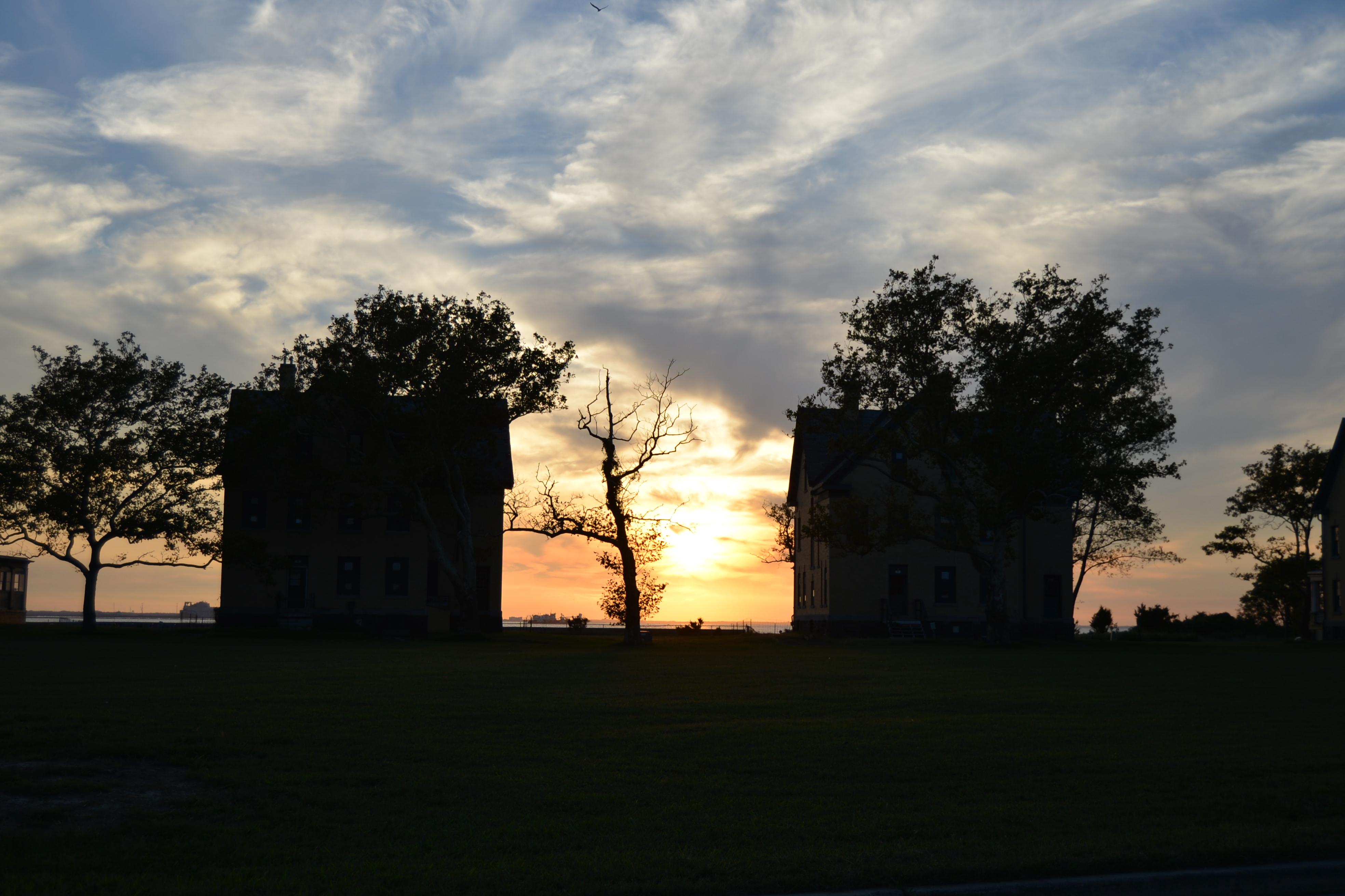 Sunset behind two buildings