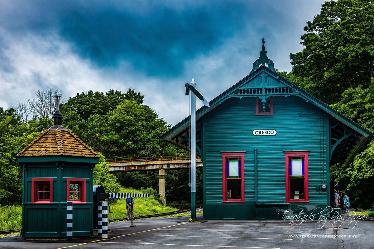 Dramatic color photo of Cresco station and buildings.