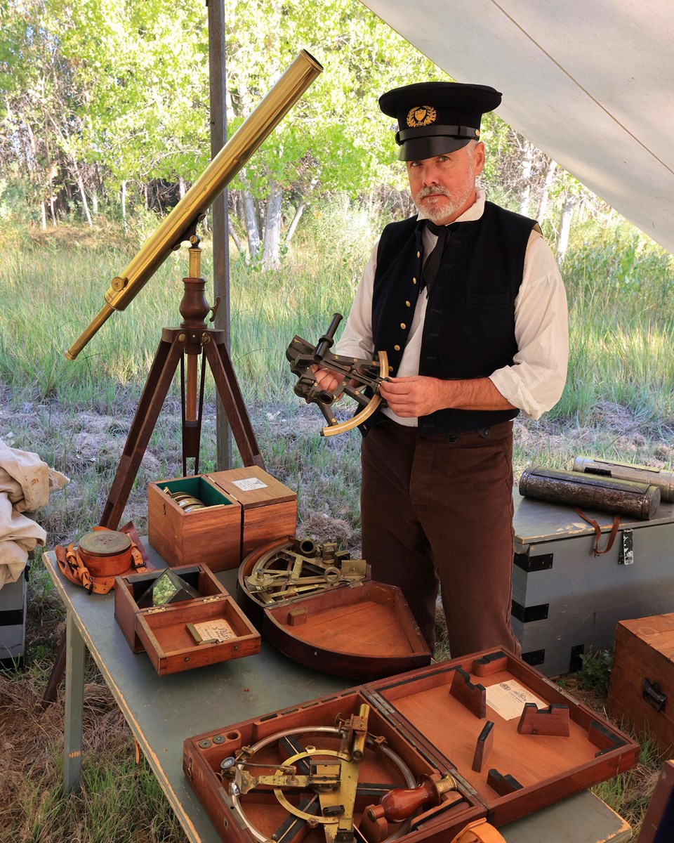 Living Historian (in 1843 period clothing) portraying John C. Fremont with surveying tools