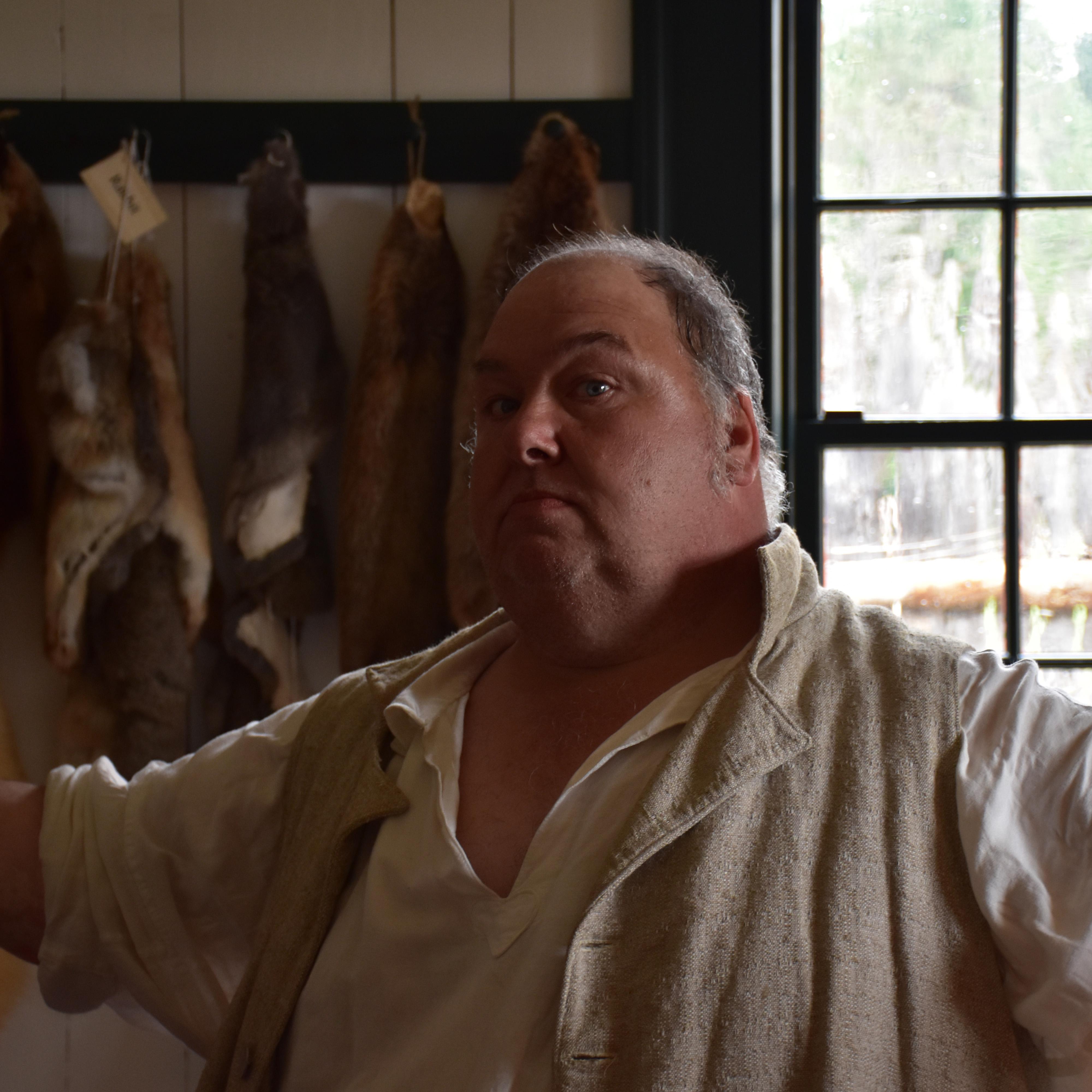 An interpreter in the Trade Shop of the Great Hall.