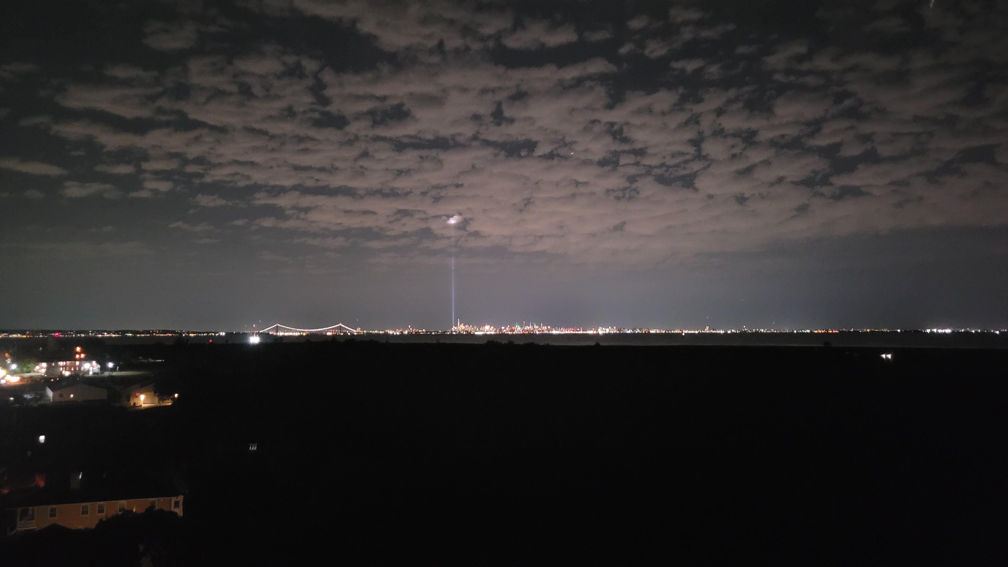 Two beams of light shining into sky