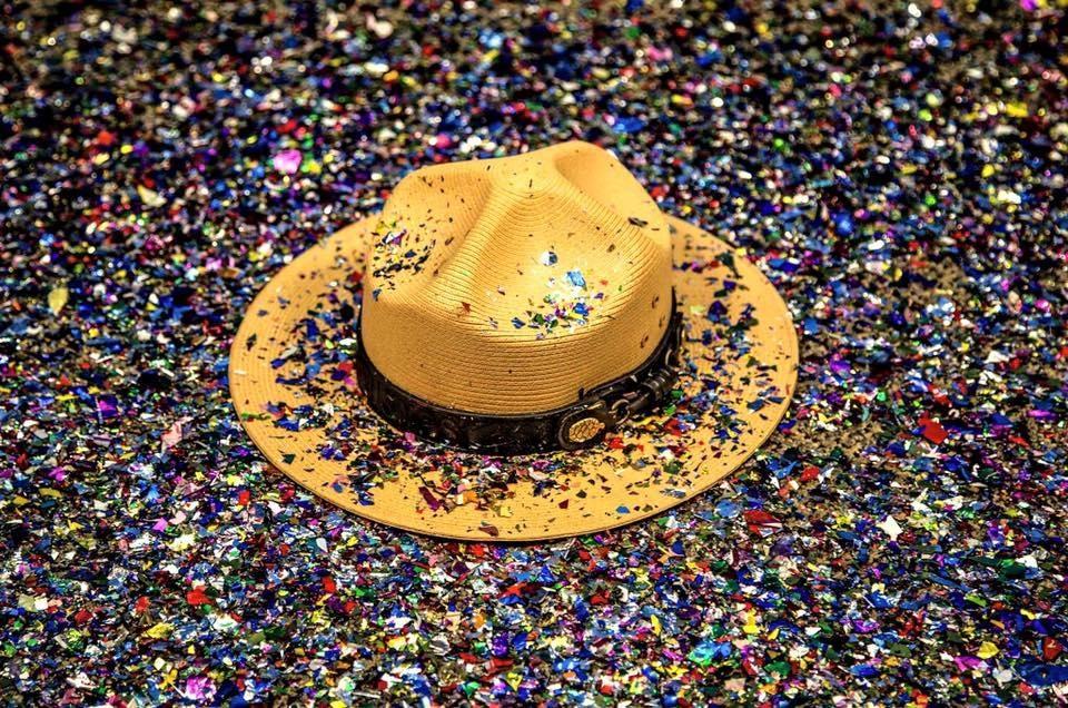 Iconic straw park ranger hat surrounded by confetti