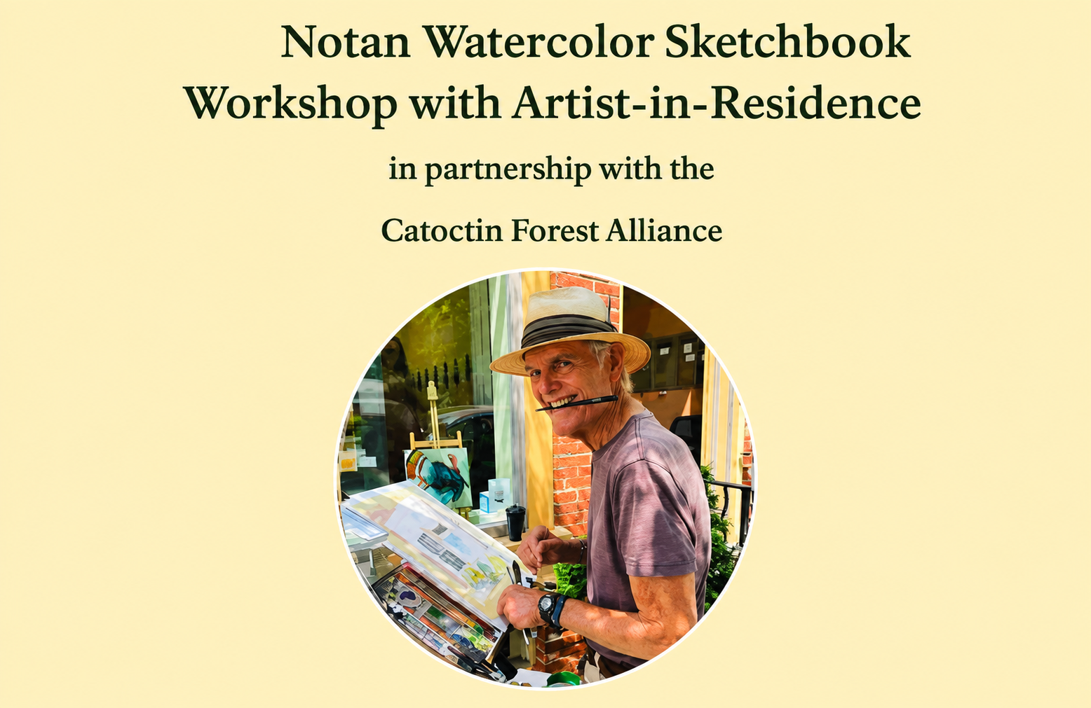 Artist-in-Residence Jerry with a hat on, painting in front of him, and a paintbrush in mouth