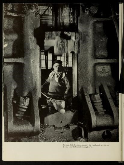 Man standing in between machines