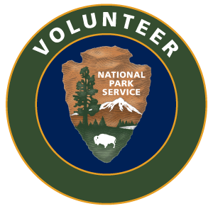 Round green and blue volunteer logo with national park service arrowhead