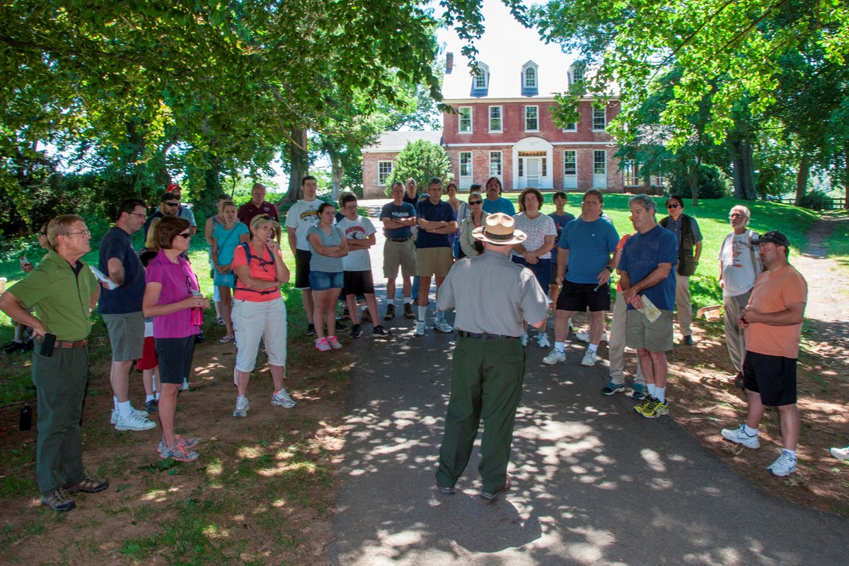 Visitors and ranger prepare to tour the Thomas House