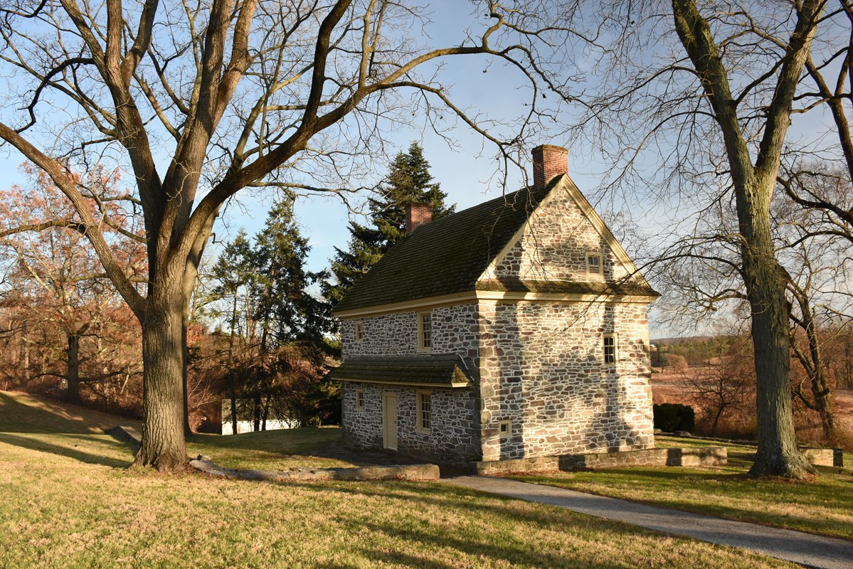 a two story stone farmhouse
