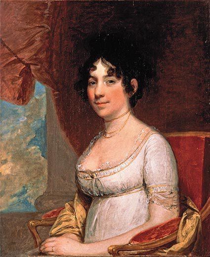 painting of a black-haired lady in a white night gown sitting in a red chair