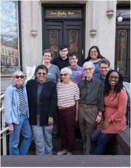 The Archivettes stand in from of The Lesbian Herstory Archives building in Brooklyn, New York