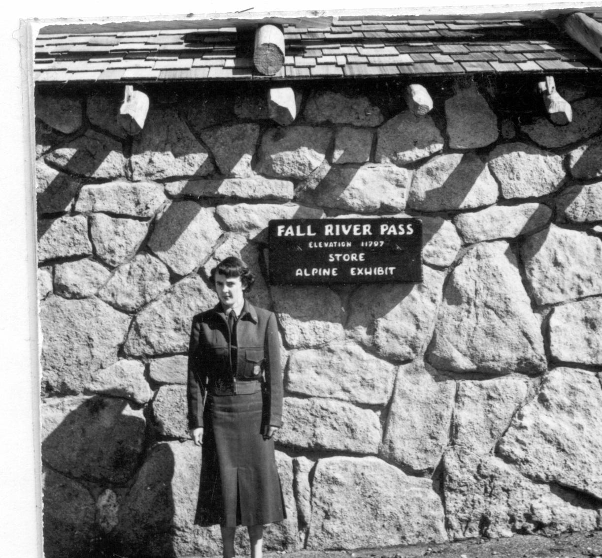 Black and white image of a female park ranger at Fall River Pass