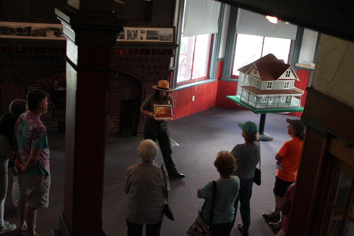 A park ranger begins a tour of the club house in 2018.