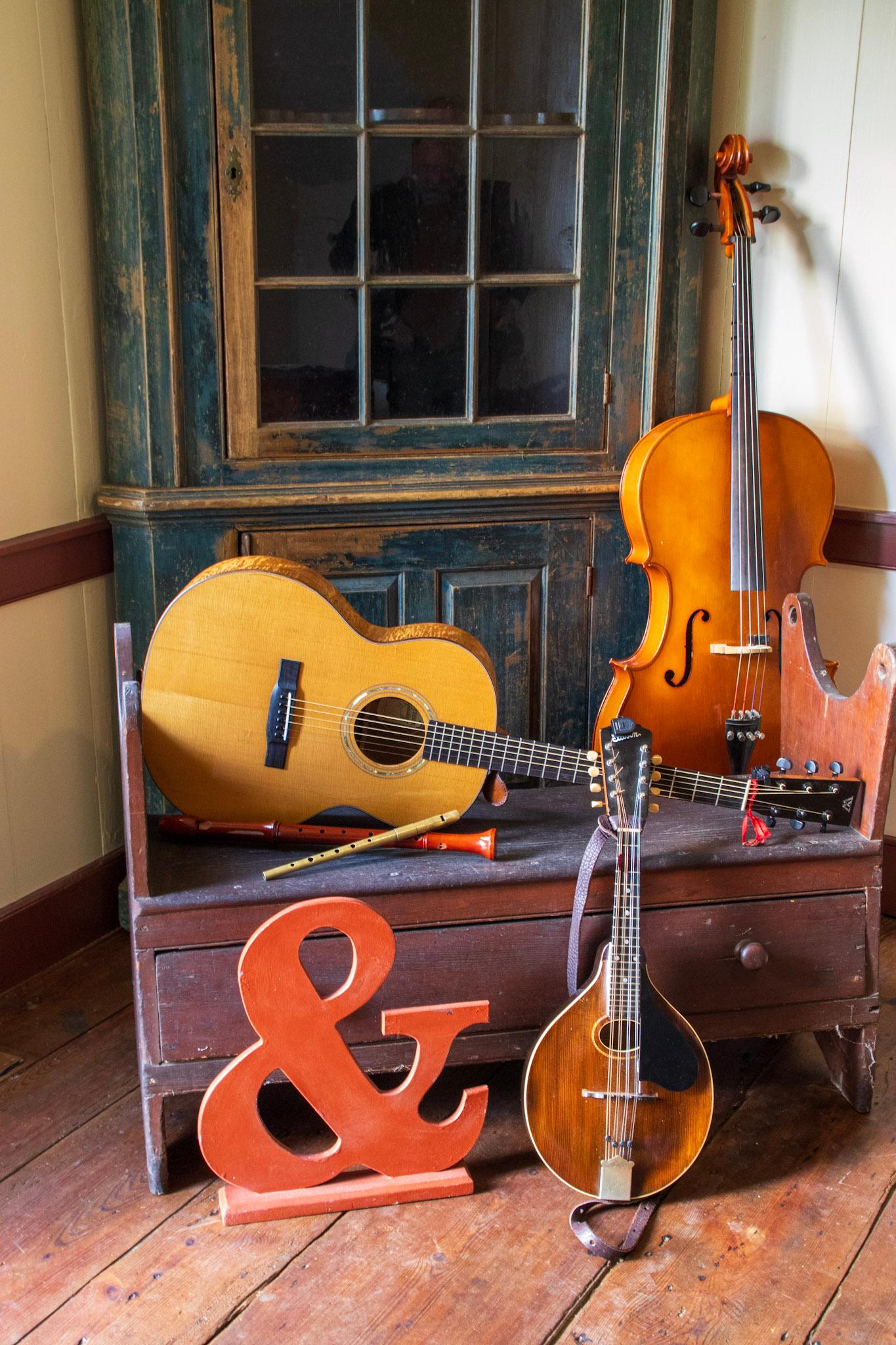 Musical instruments arranged on furniture.
