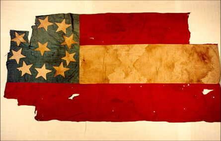 A tattered Civil War Era Confederate flag