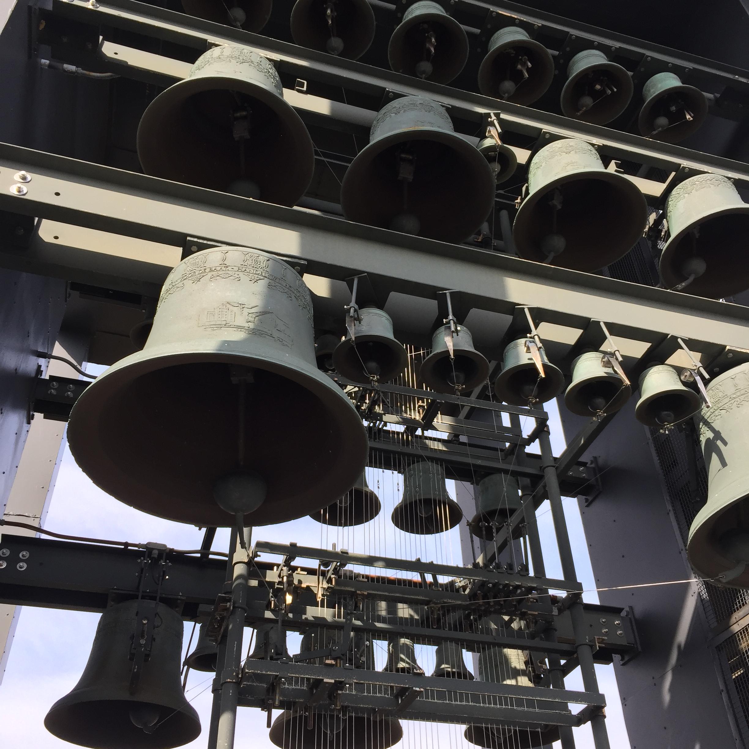 Large metal bells hang from beams.