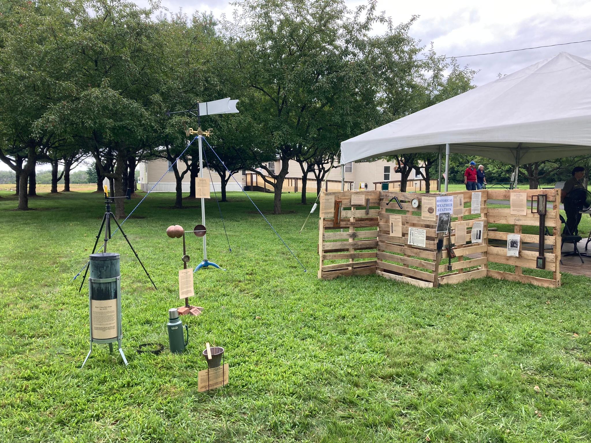 Vintage weather instruments on the lawn.