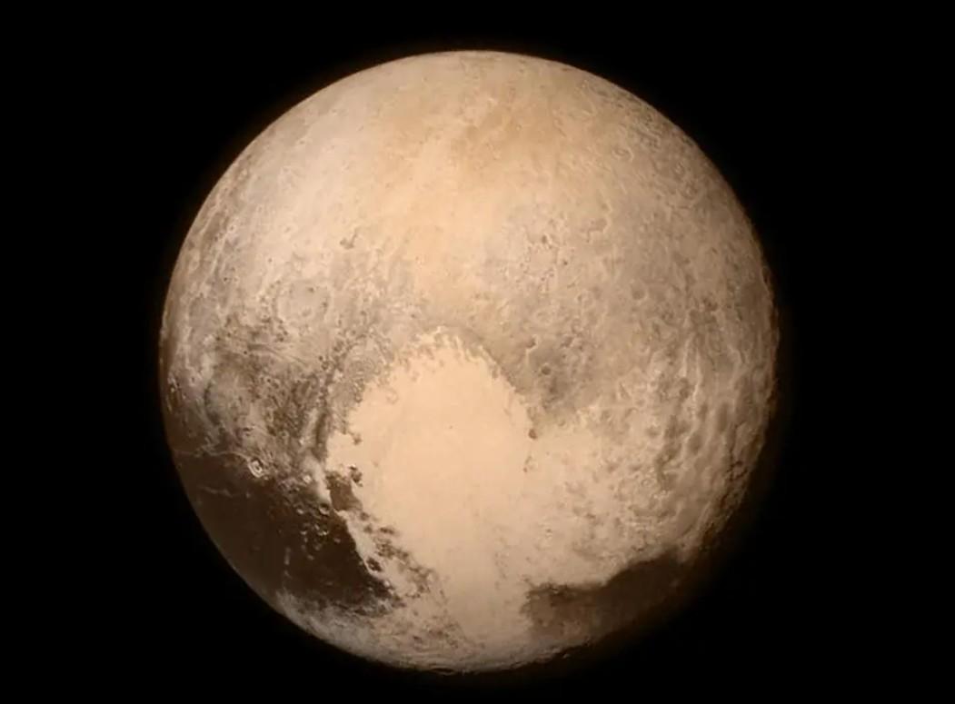 Beige planet against a dark sky