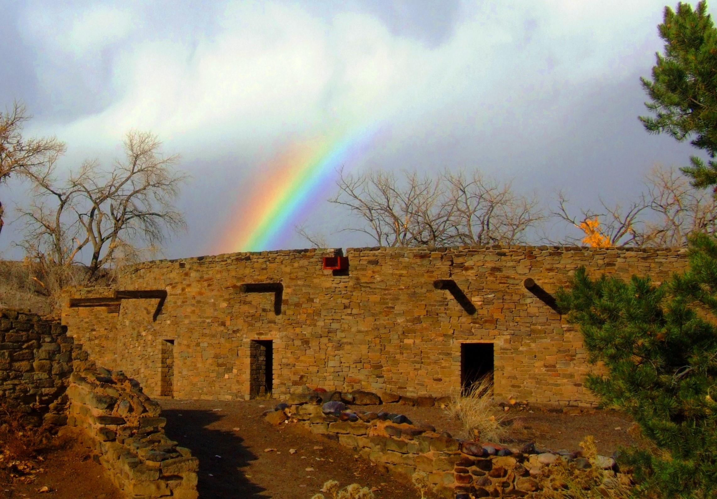 A rainbow shining over the Great Kiva.