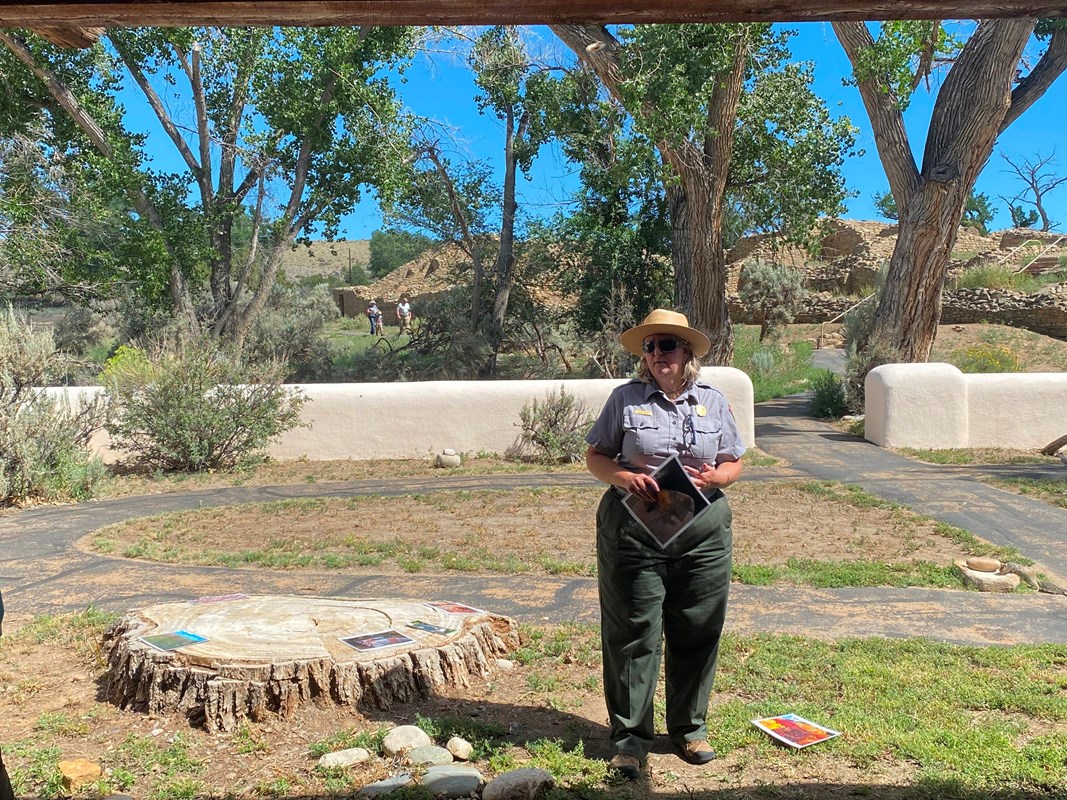 A ranger giving a talk to visitors outside the visitor center.