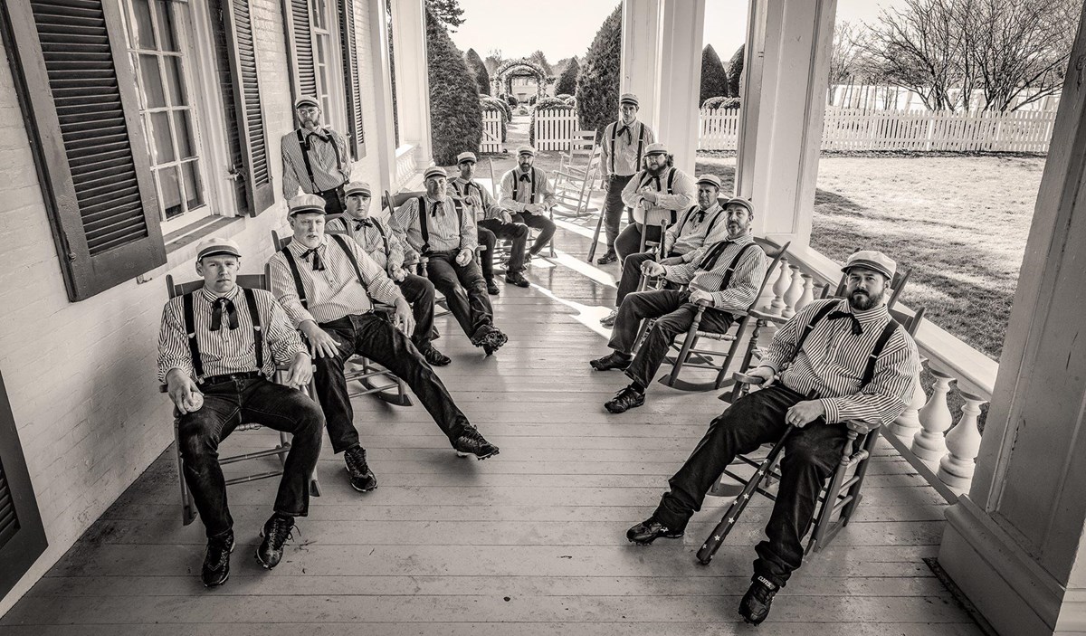 A group of base ball players in period uniforms.