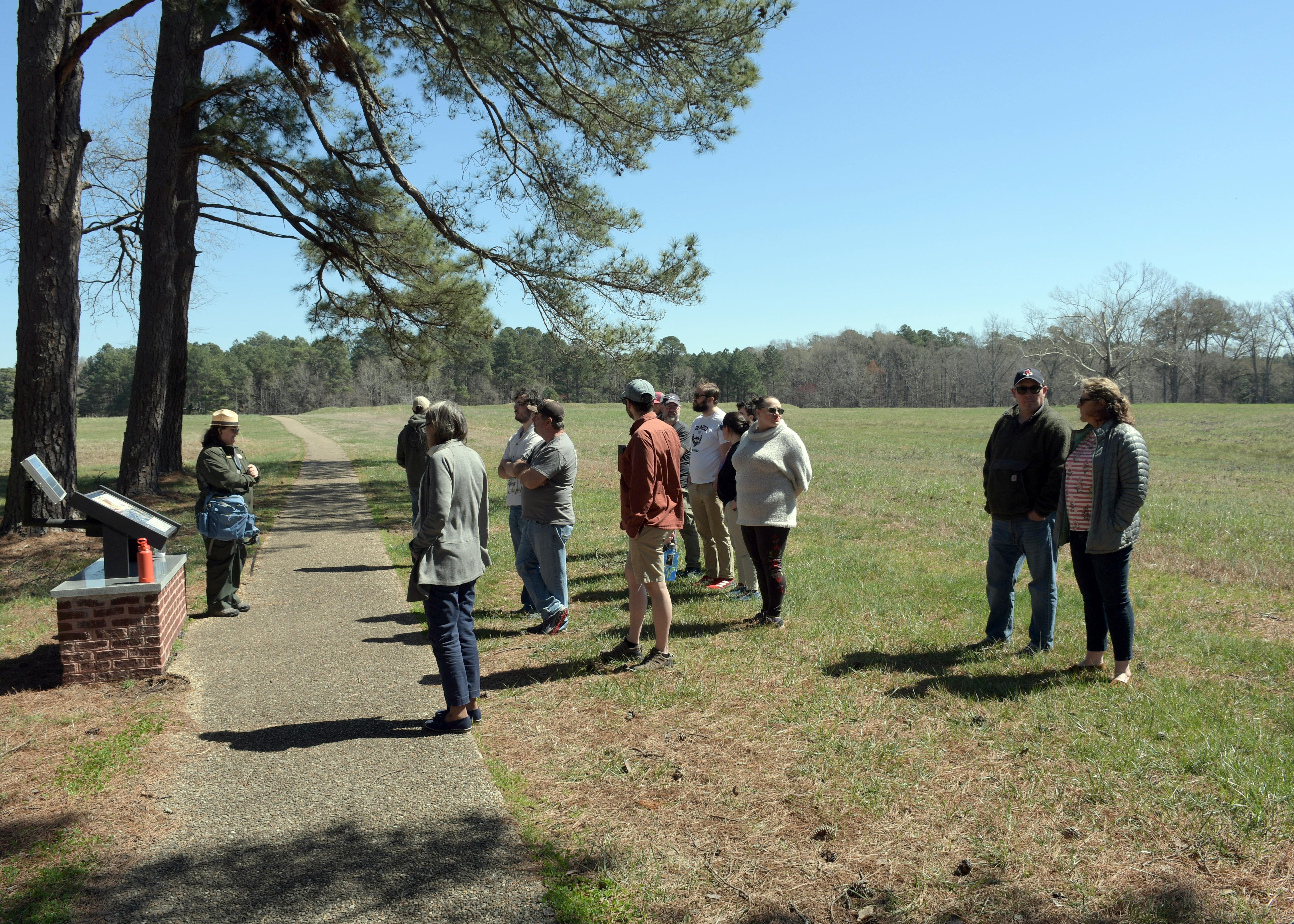 A female park ranger talks to visitors at Fort Stedman.