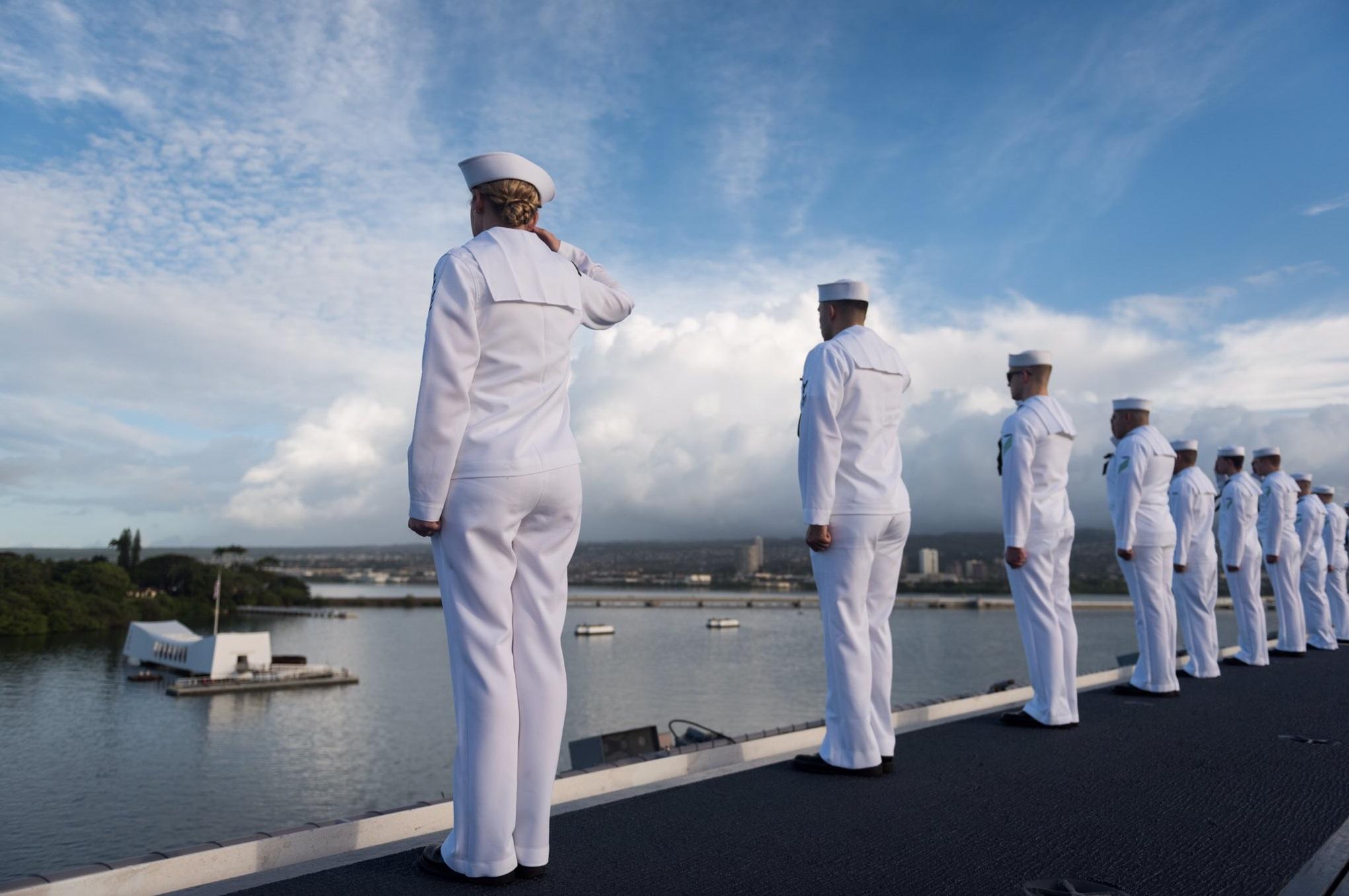 USS Stennis passing by the USS Arizona Memorial.