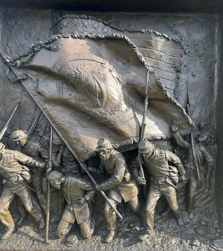 close up of soldiers depicted on monument