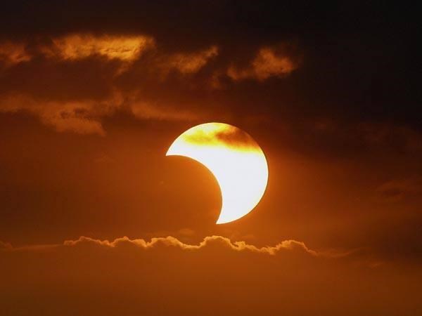 A solar eclipse (total or partial) occurs when the moon passes between the sun and Earth.
