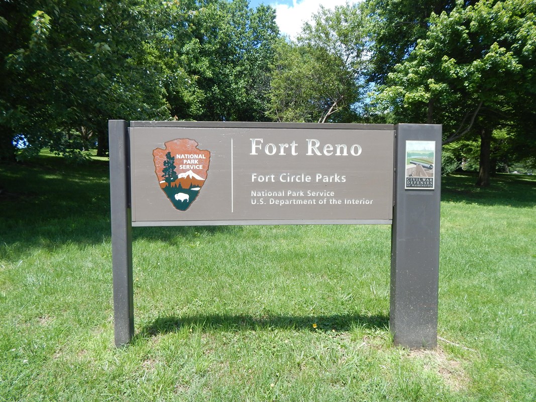 Fort Reno sign in front of trees