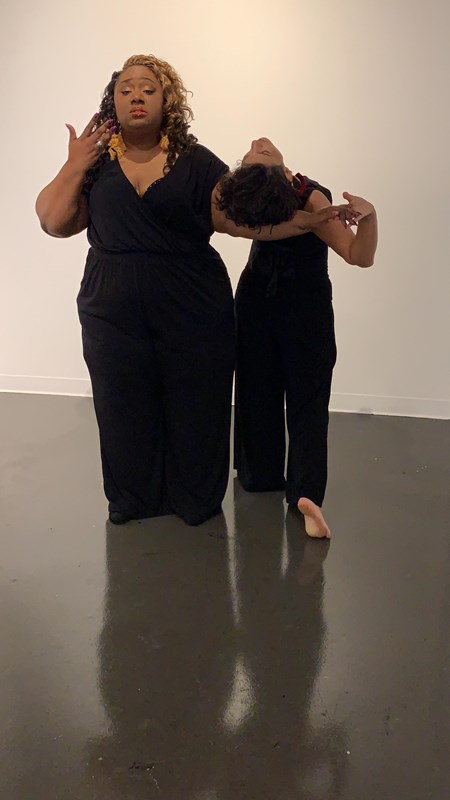 San Antonio poet Laureate Andrea Sanderson and dance artist Amber Ortega pose together wearing black